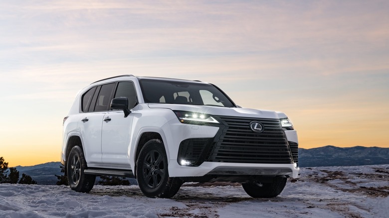 2024 Lexus LX 600 Premium parked on a snowy trail with sunset in the background