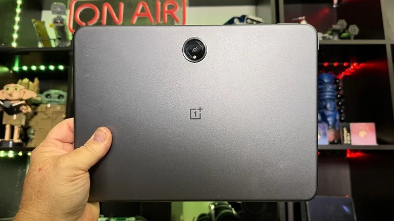 The OnePlus Pad 2 being held by a hand.