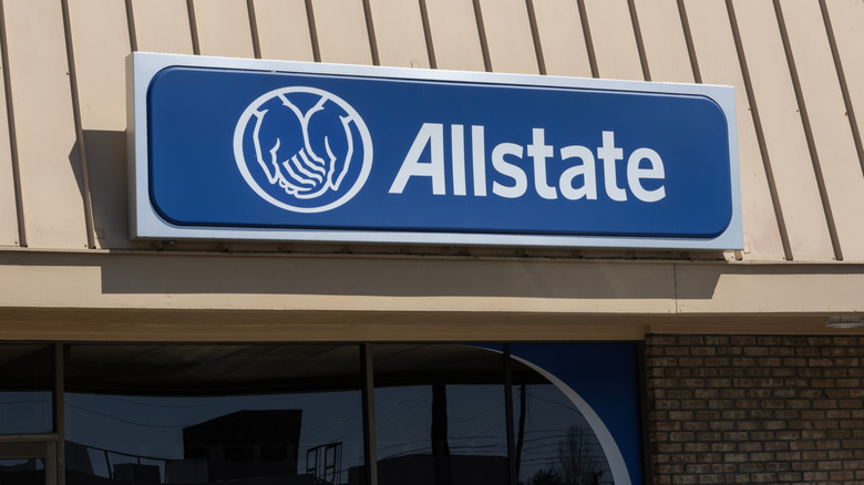 An Allstate sign on a strip mall building