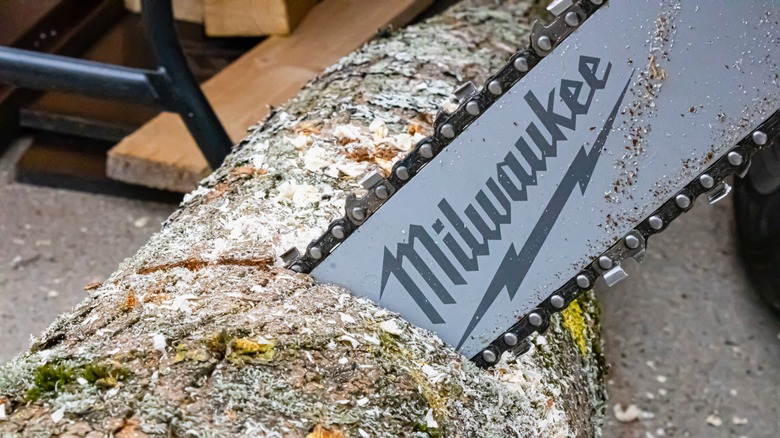 Milwaukee chainsaw cutting log