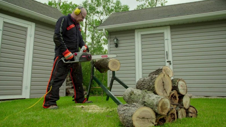 cutting wood with Oregon chainsaw