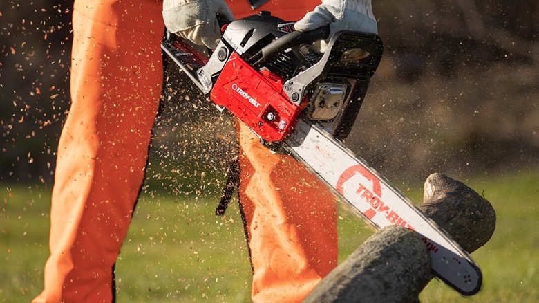 cutting lumber with a Troy-Bilt chainsaw