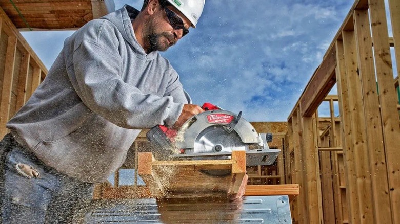 Construction Worker using a circular saw