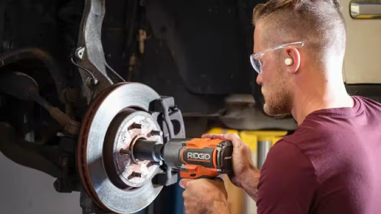 man using Ridgid impact wrench on wheel nut