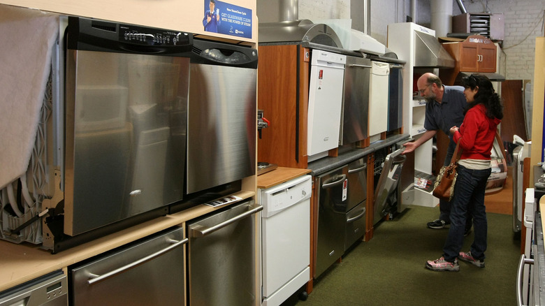 shopper looking at dishwashers