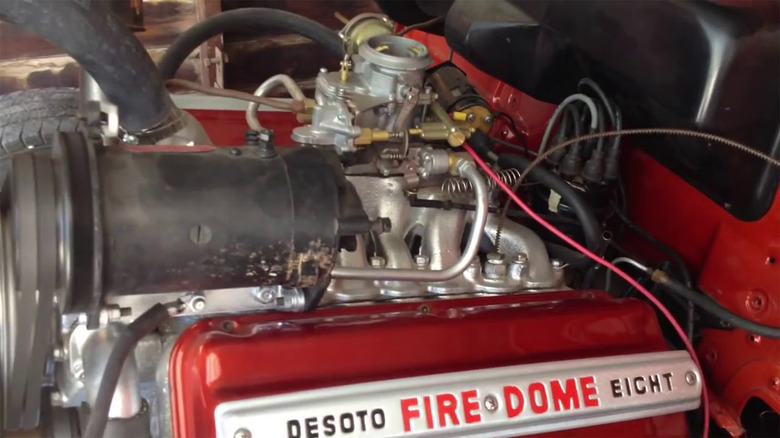 A DeSoto FireDome painted red in an engine bay