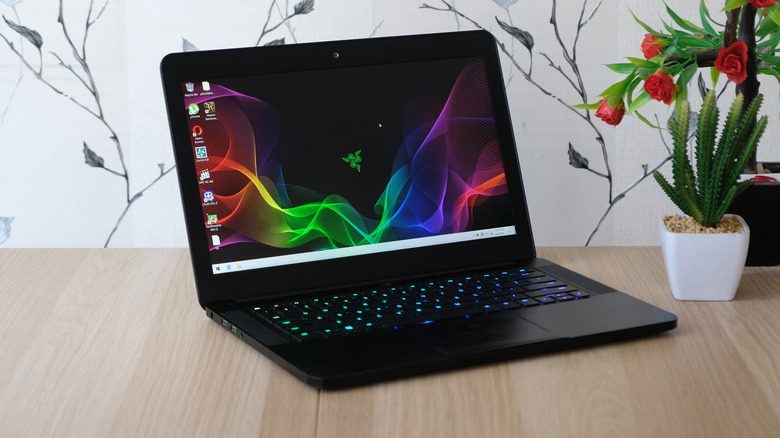 Man playing on Razer laptop