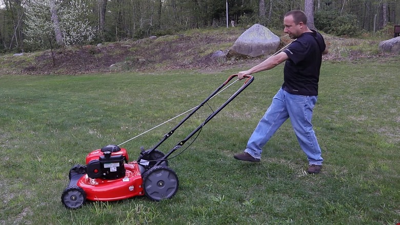 Guy starting Craftsman mower