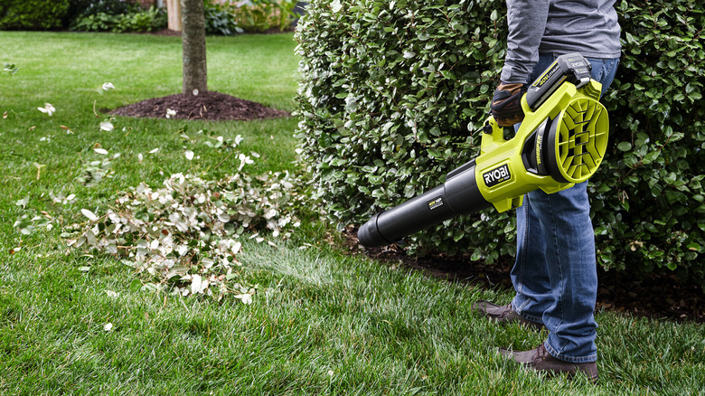 Person using Ryobi leaf blower