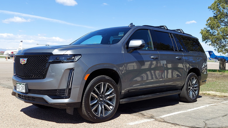 Gray Cadillac Escalade parked airport