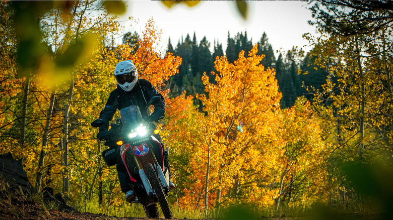 Person wearing Klim gear riding a motorcycle