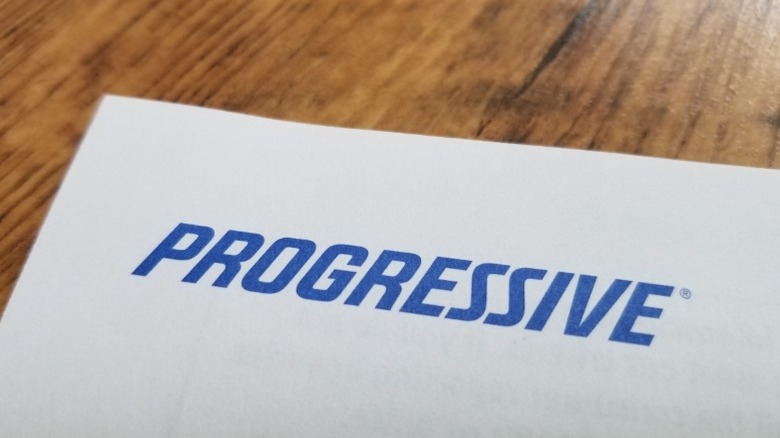 Progressive insurance's logo on a paper