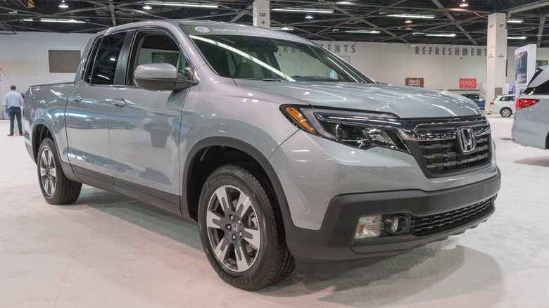 A gray Honda Ridgeline on a showroom floor