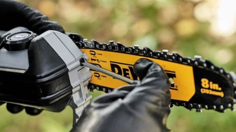 Closeup of DeWalt pole saw maintenance