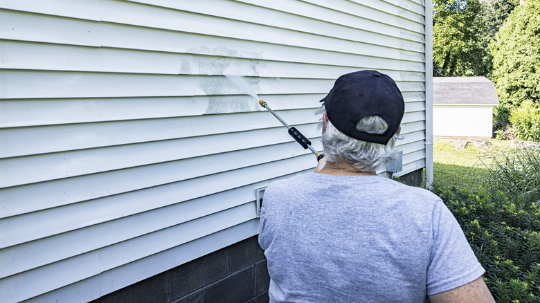 Person using a pressure washer