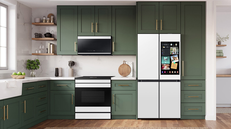 A Samsung Bespoke kitchen with green cabinets