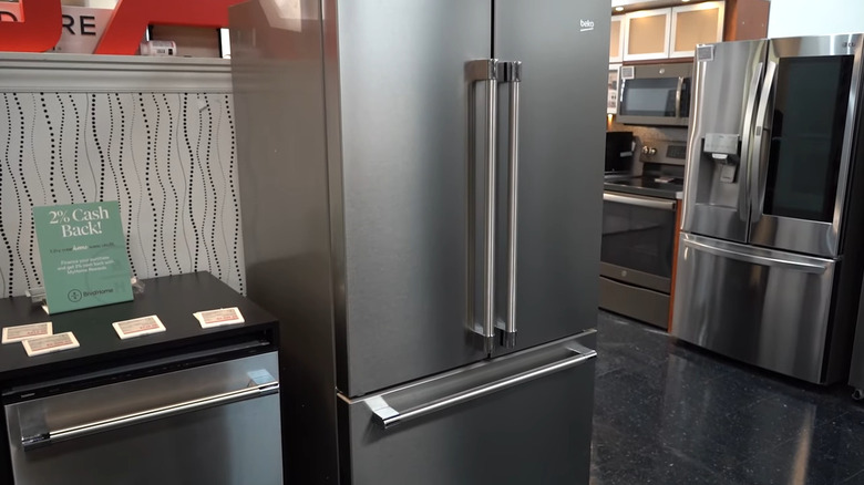 Beko fridge with other appliances around it