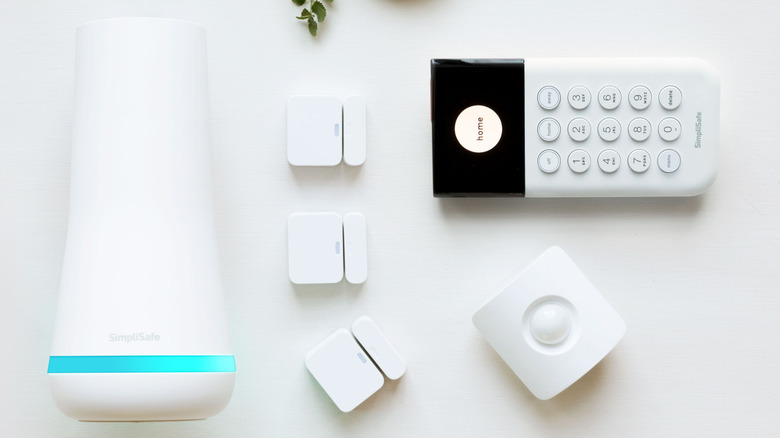 Various SimpliSafe devices arranged on a white background.