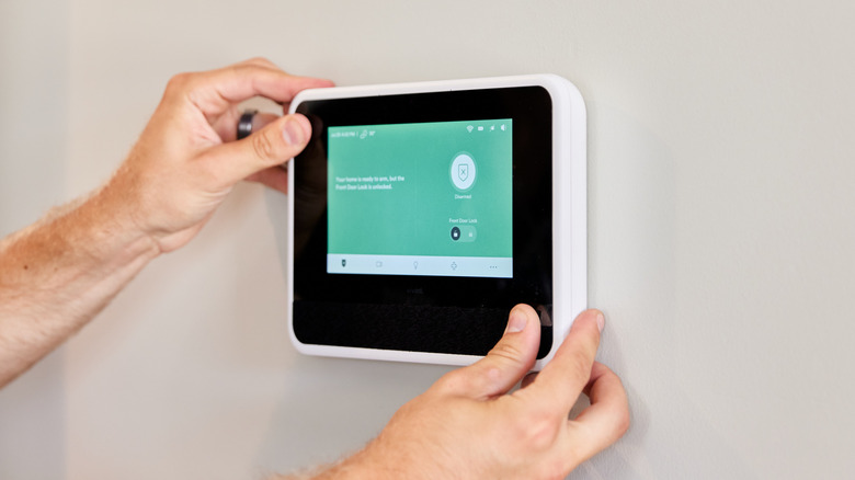 A Vivint SmartHub being installed inside a house.