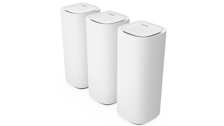 Three Linksys Velop Pro 7 routers on display