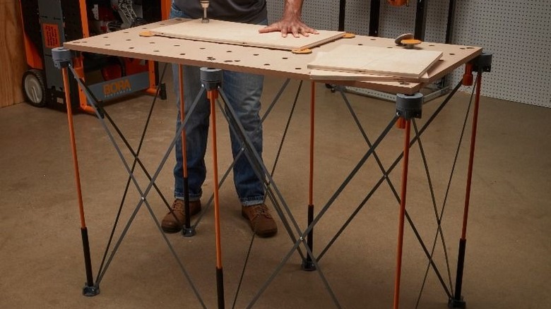 Man working on a BORA centipede workbench