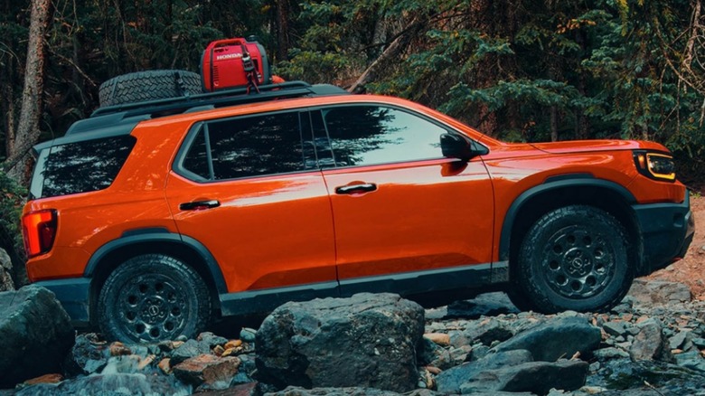 A 2026 Honda Passport driving off-road.