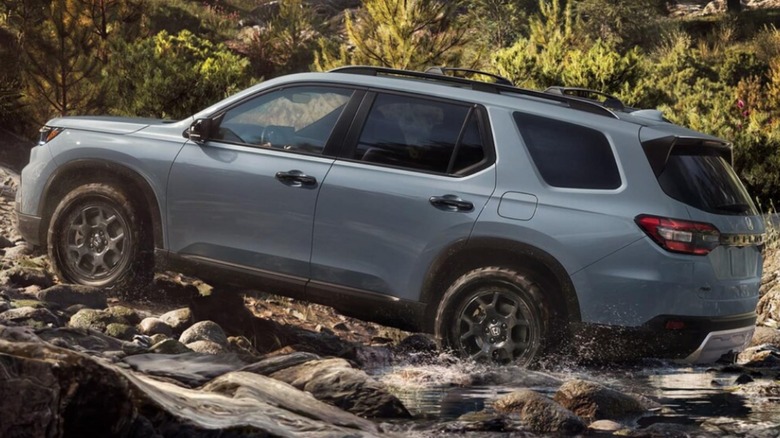 A 2025 Honda Pilot driving off-road.