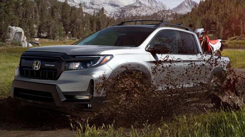 A 2025 Honda Ridgeline driving off-road.