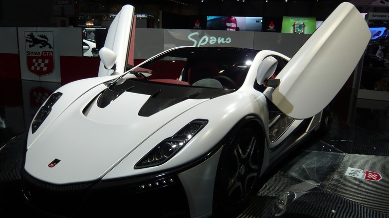 White Spania GTA Spano parked with doors open