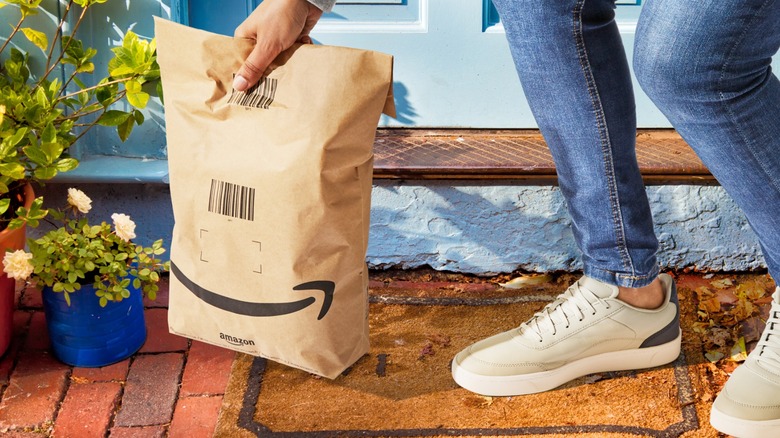 Amazon bag held by doorstep