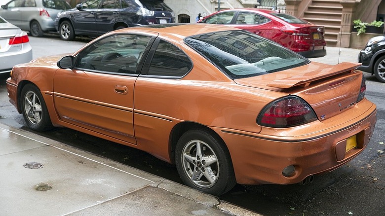 Orange 2004 Pontiac Grand Am GT parked on street