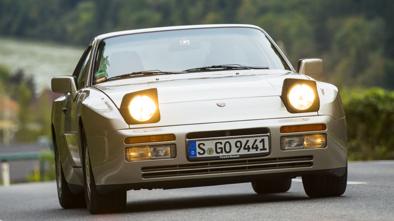 Front view of of gold Porsche 944 Turbo.