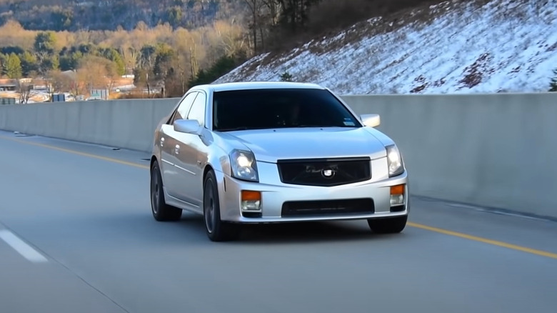 First-gen Cadillac CTS-V driving at speed on the highway