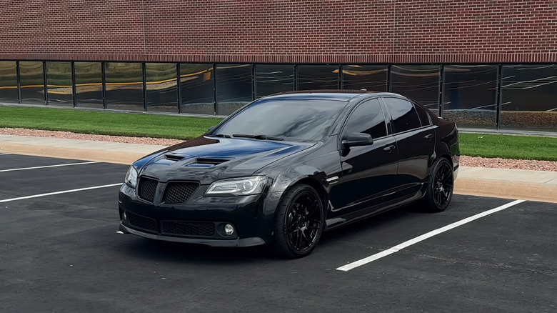 Black Pontiac G8 GXP parked on an empty parking lot