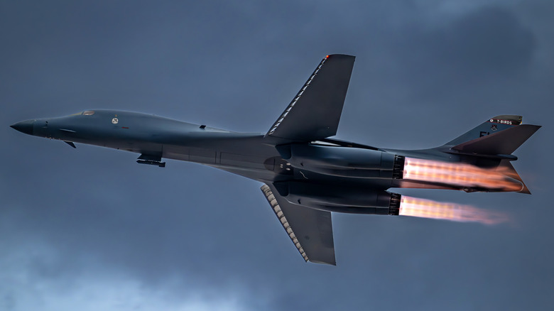 B-1B Lancer as seen from below while flying over grey and cloudy skies