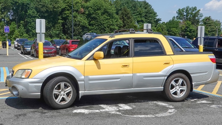 yellow and silver Subaru Baja