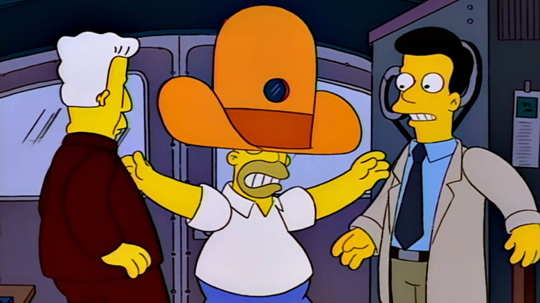 Homer Simpson wearing a camera inside an oversized novelty hat