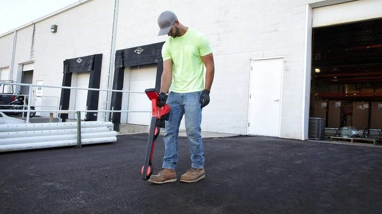 man using pipe locator