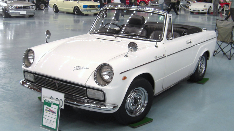 A white Toyota Publica Convertible on display.