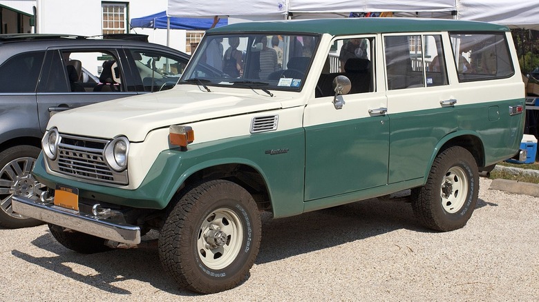 green and white toyota land cruiser j55