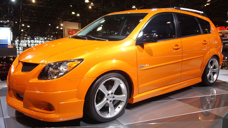 Orange Pontiac Vibe in show room