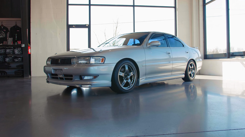 White Toyota Cresta parked inside a showroom