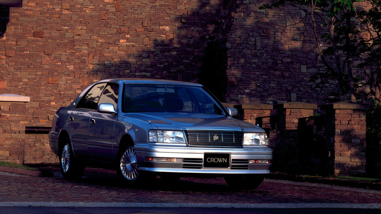 Silver metallic Toyota Crown parked