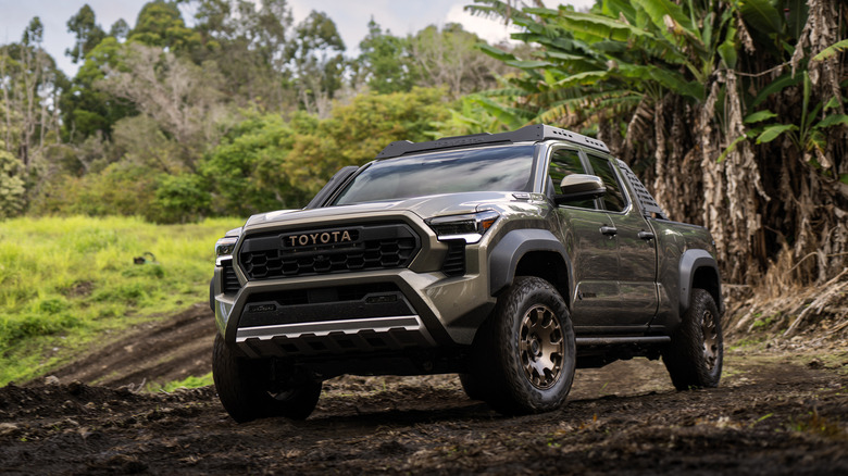 2024 Toyota Tacoma Trailhunter off-roading on mud-covered trails