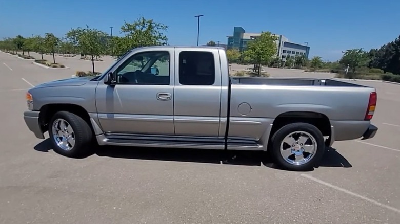 silver gmc sierra c3 pickup truck parking lot