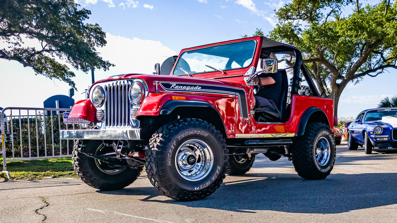 A 1970s Jeep CJ Renegade at an auto show