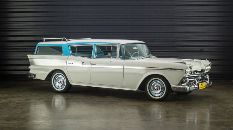 A white and blue AMC Ambassador in a garage