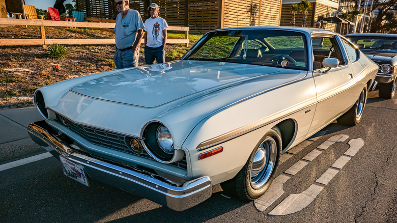 A white AMC Matador on a city street