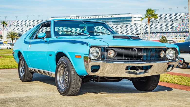 A blue AMC AMX Spirit at an auto show