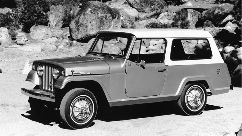 A 1970s Jeep Commando on a beach in black and white